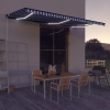 Toldo retráctil manual con luz LED azul y blanco 600x300 cm