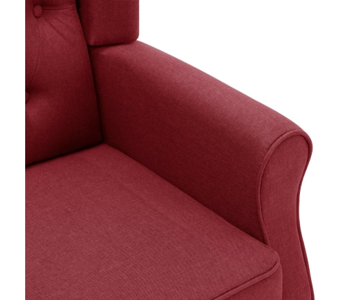 Sillón con reposapiés de tela rojo tinto