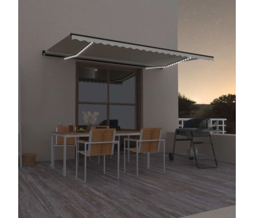 Toldo retráctil manual con luz LED crema 500x300 cm