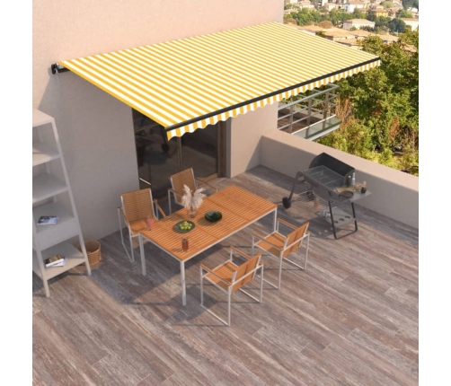 Toldo retráctil manual amarillo y blanco 600x350 cm