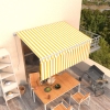 Toldo retráctil manual con persiana amarillo y blanco 3x2,5 m