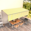 Toldo retráctil manual con persiana amarillo y blanco 6x3 m