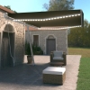 Toldo retráctil manual con LED gris antracita 500x350 cm