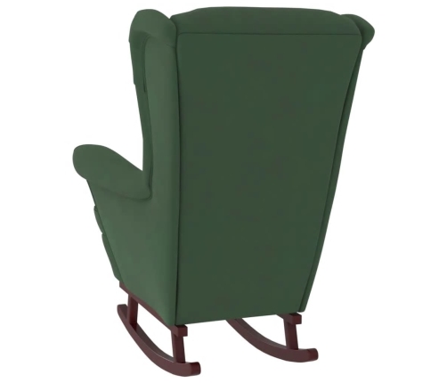 Sillón mecedora patas madera y taburete terciopelo verde oscuro