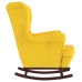 Sillón mecedora patas madera y taburete terciopelo amarillo