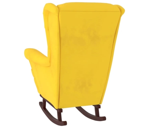 Sillón mecedora patas madera y taburete terciopelo amarillo