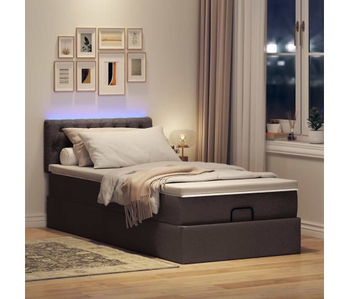 Cama otomana con colchón y LED tela marrón oscuro 90x200 cm